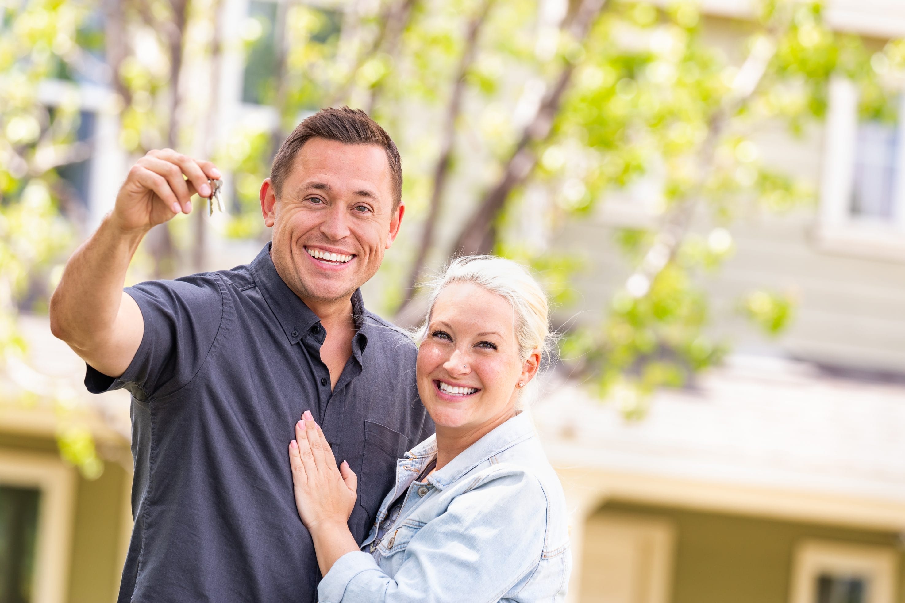 Realtors holding keys after successful radon mitigation for realtors

